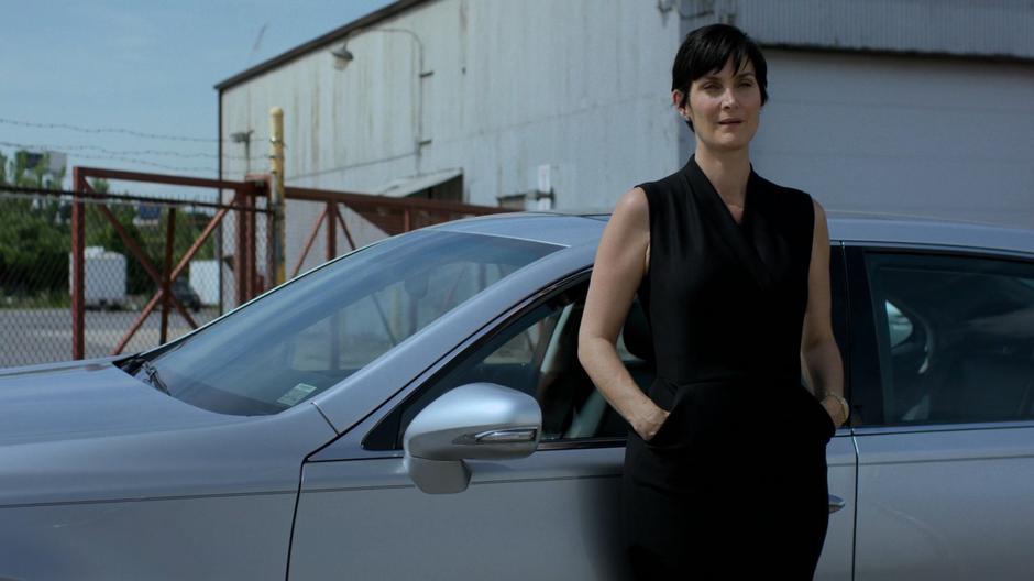 Hogarth leans against her car and waits for Shane to be released.
