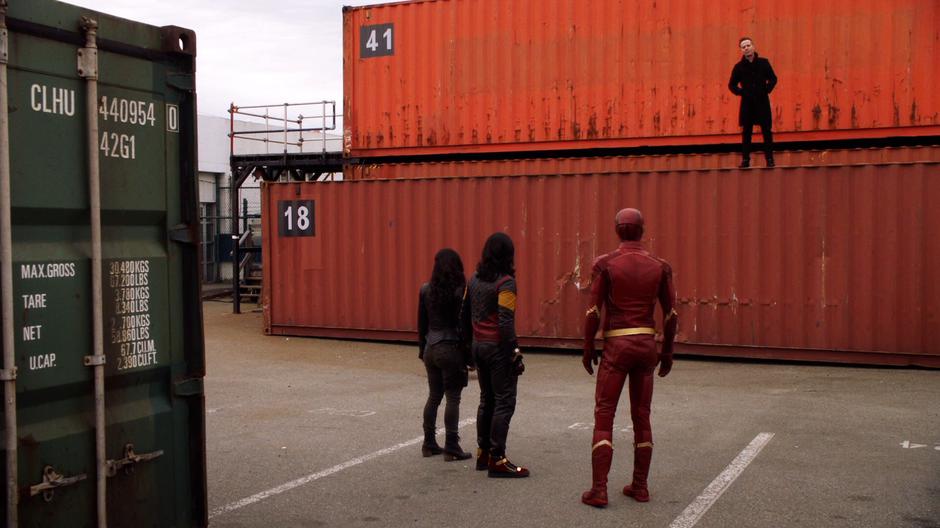 Clifford DeVoe stands atop container 18 and tells Cyntha, Cisco, and Barry that they are too late.