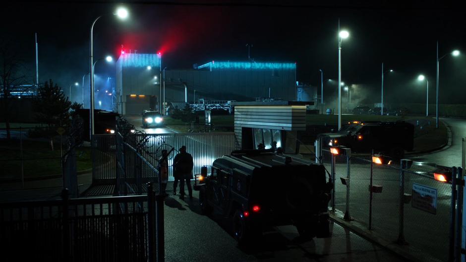 Clifford DeVoe approaches the guards posing as John Diggle.