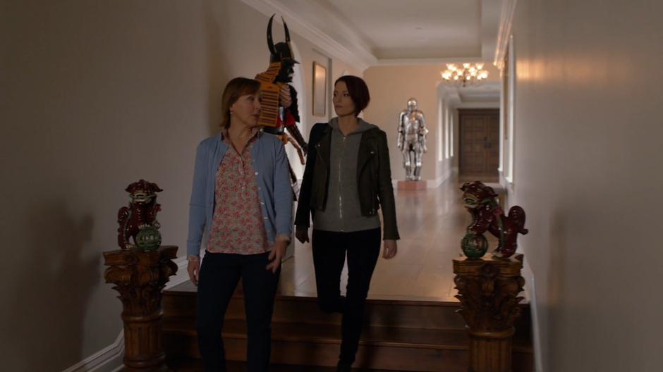 Mrs. Queller escorts Alex through the mansion.