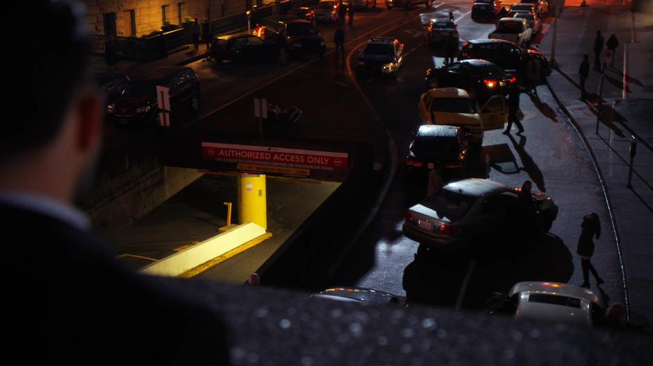 Captain Singh looks down at the stopped traffic in the street.