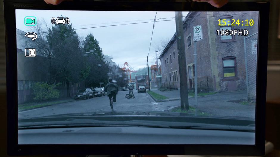 The police car's dash cam footage shows Clive running down the street while Liv abuses the suspect with a fish.