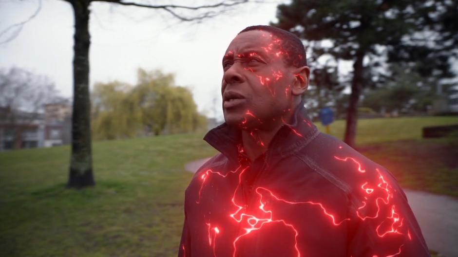 J'onn transforms back into his normal form.
