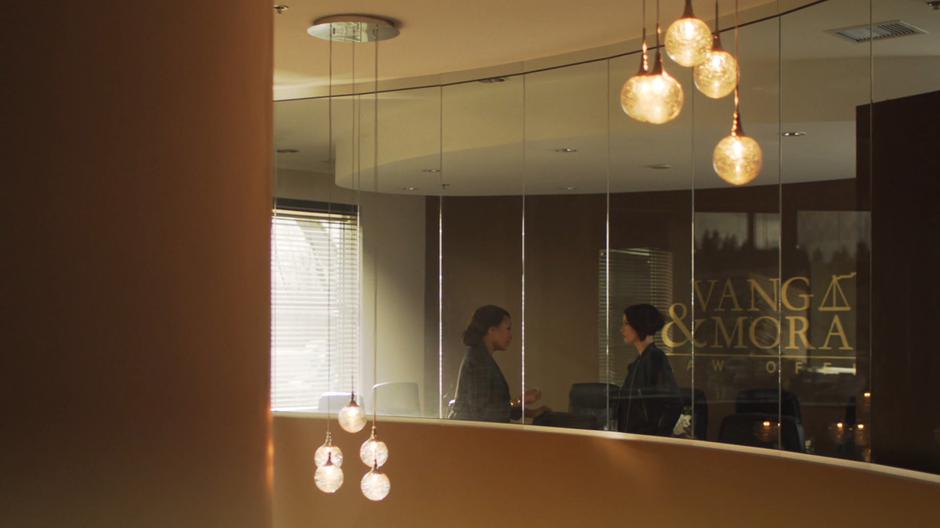 Alex talks to Lynn Vang in the upstairs boardroom.