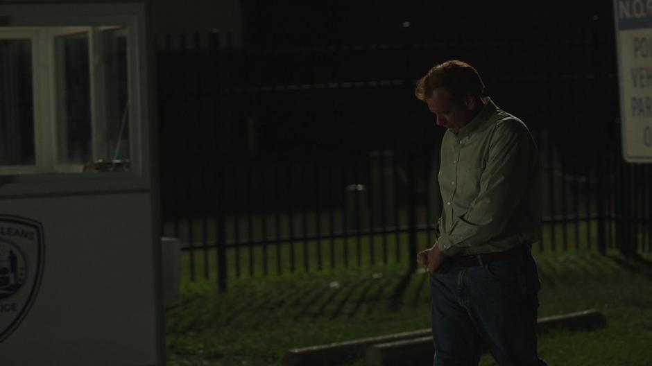 Detective Connors reaches for his keys in his pocket while walking to his car at night.