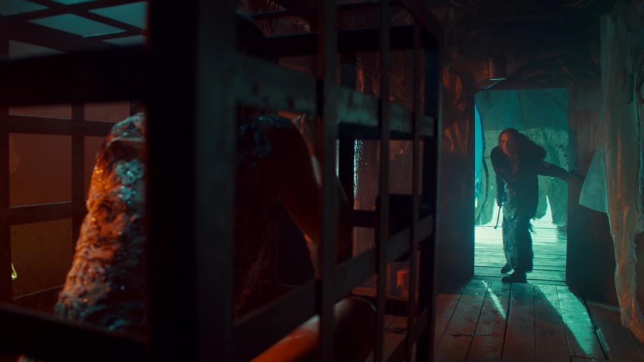 Waverly motions for Wynonna to stop as Wynonna enters through the door of the cabin.