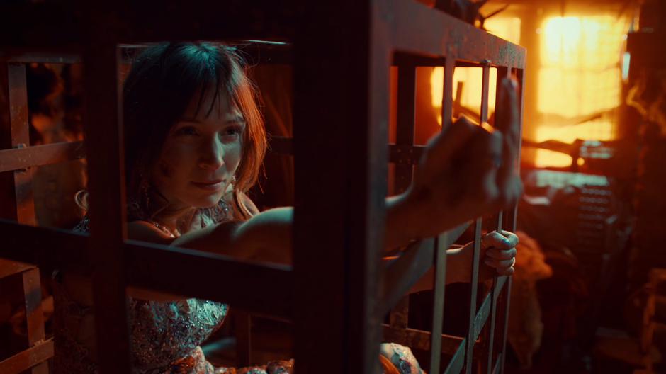 Waverly flicks off the Revenant through the bars of her cage.