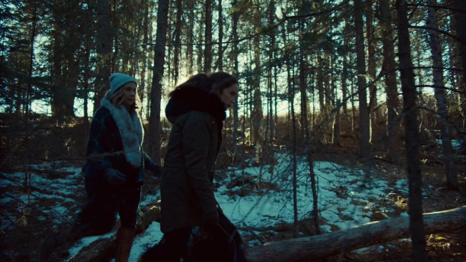 Wynonna follows the tracks through the woods while talking with a vision of her mother.