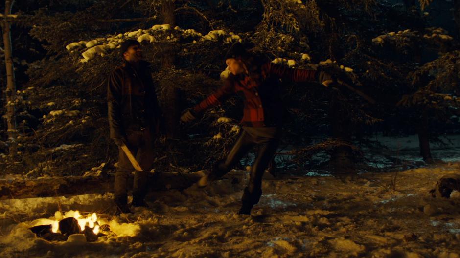 Wynonna falls to the ground after swining at the Revenant.