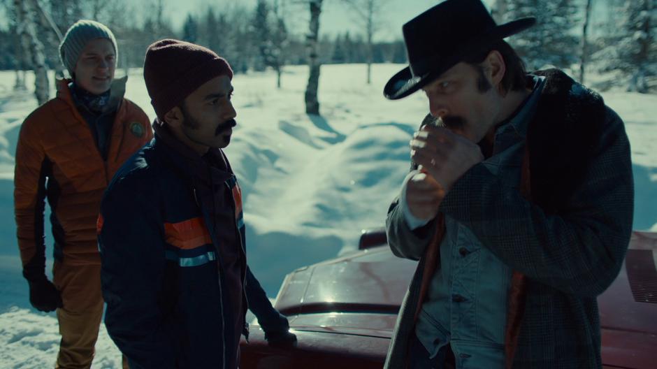 Jeremy and Robin find Doc lighting a cigarette by his car after finding their way out of the woods on their own.