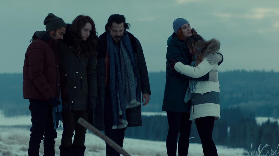 Nicole holds Waverly while standing at Dolls' grave with Jeremy, Wynonna, and Doc.