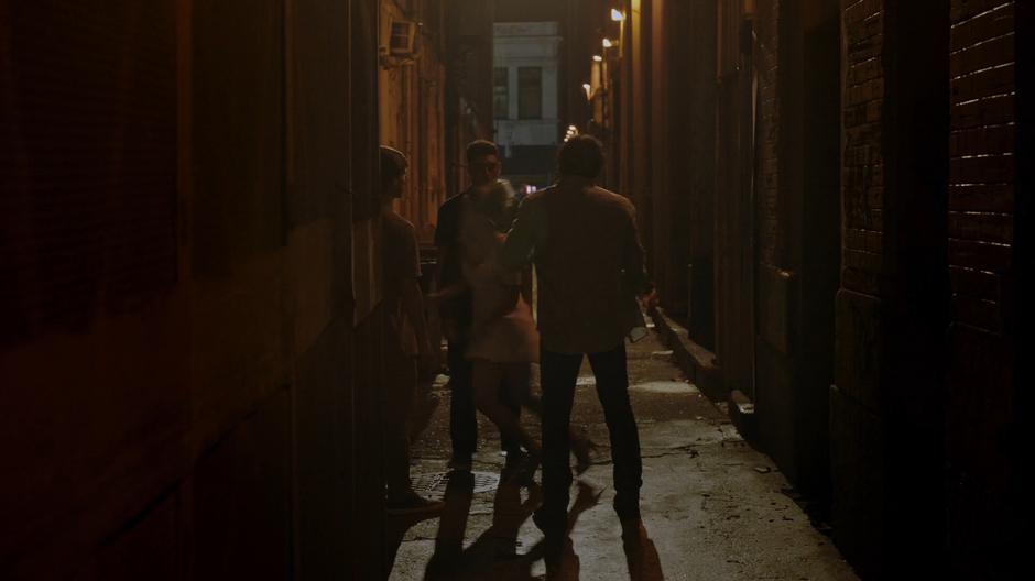 Tandy is pushed down the alley by Rick and his friends.