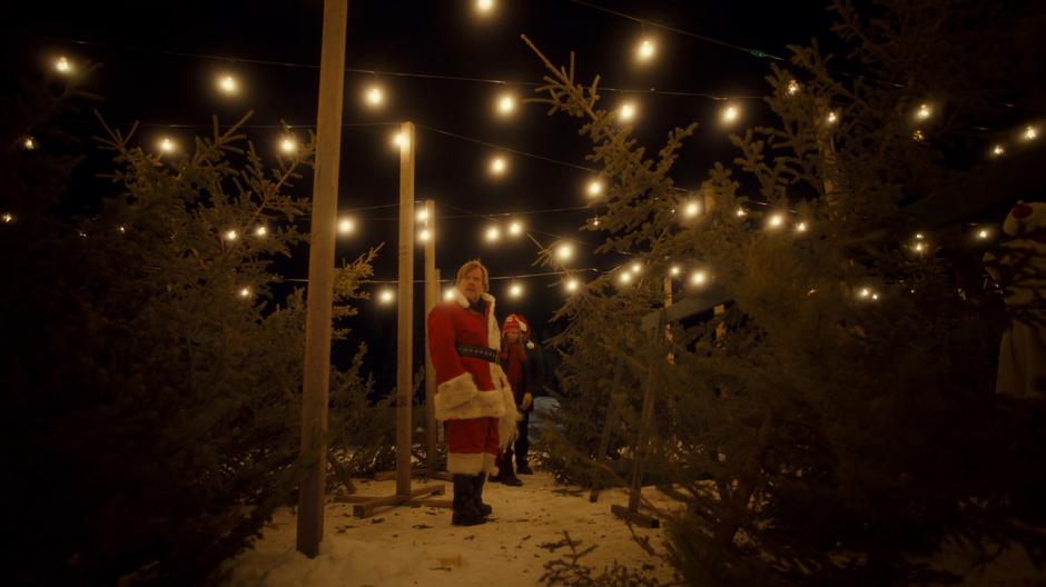 Nedley searches around the Christmas trees for the kid who ran off.