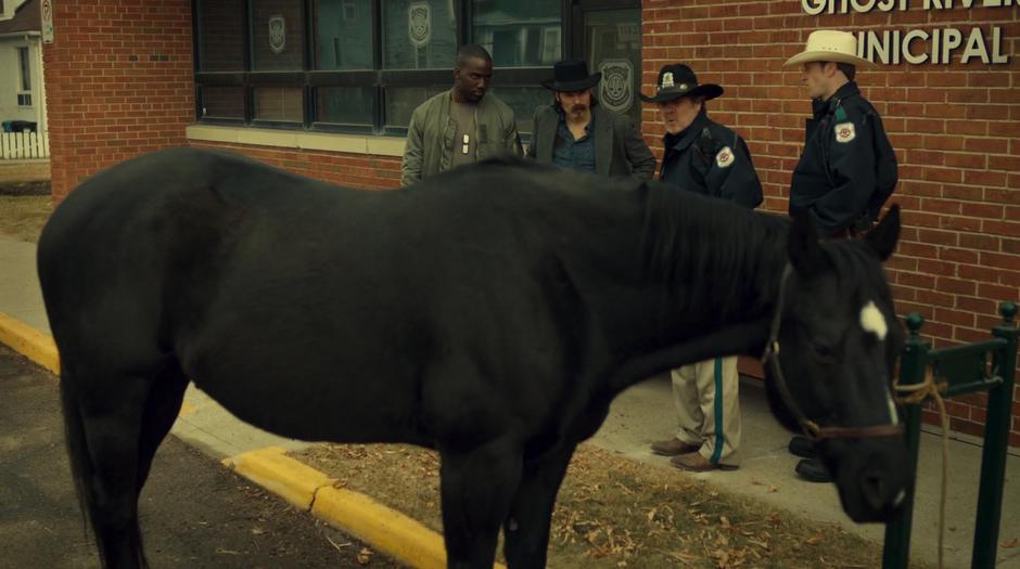 Nedley tells Doc to move his horse from out front of the building.