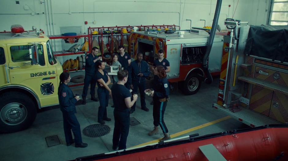 Waverly hands out donuts to the firefighters while Nicole tries to smooze them.