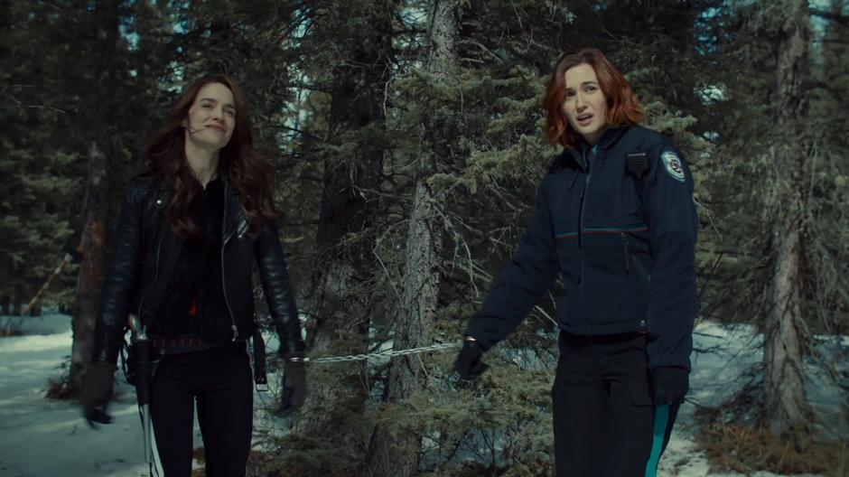 Wynonna and Nicole look over with exhaustion at the Revenants.