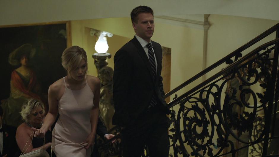 Tandy and Liam walk up the stairs in their new fancy clothes.