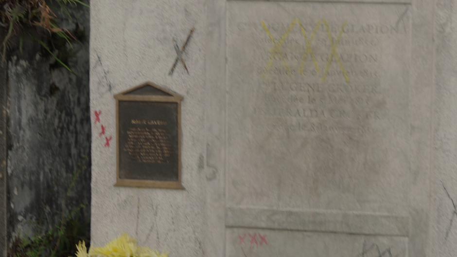 Cross marks adorn Marie Laveau's tomb.
