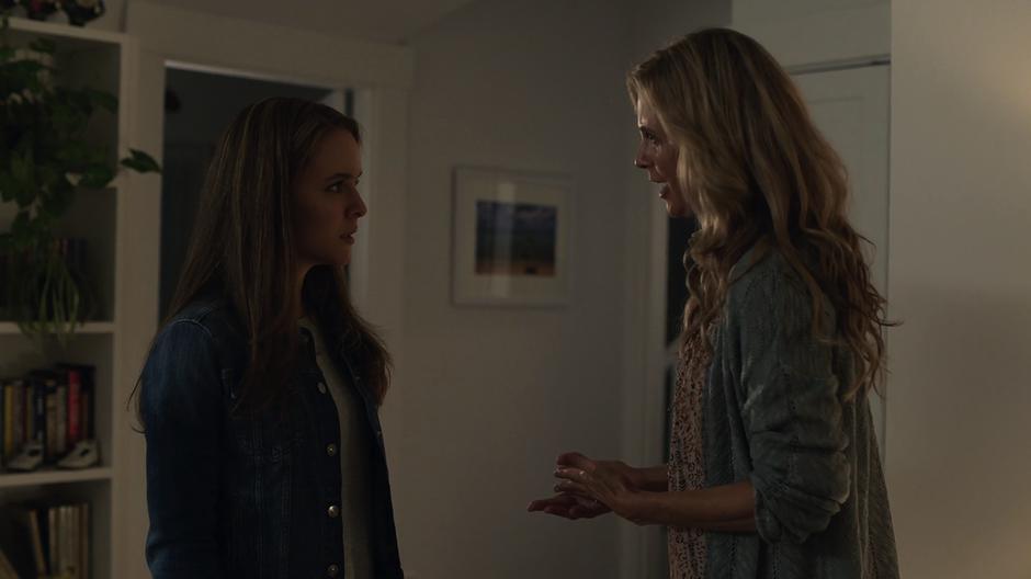 Eliza talks to young Kara in the hallway.