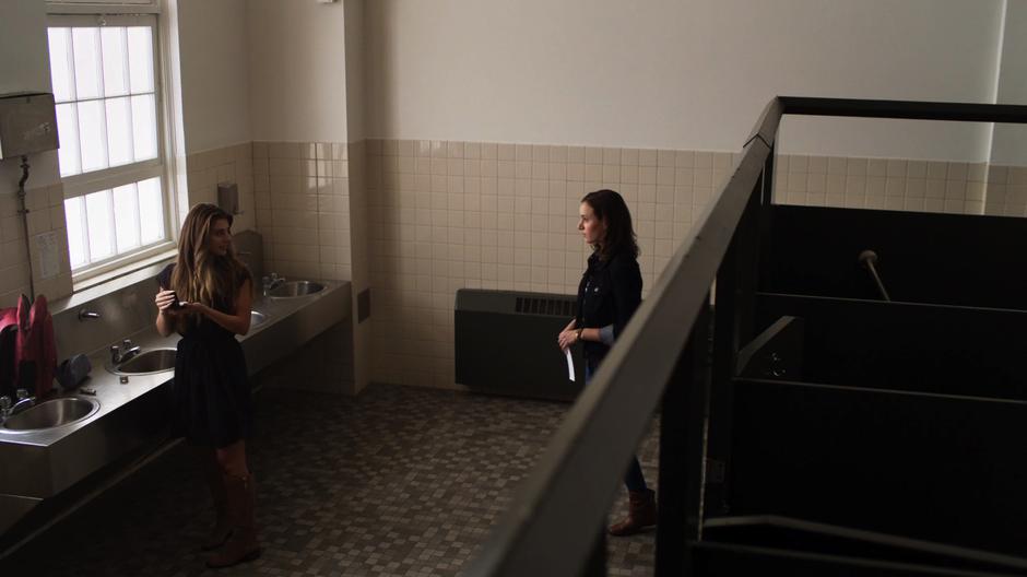 Alex walks into the bathroom with an incriminating photograph of Josie to talk to her about Mr. Bernard.