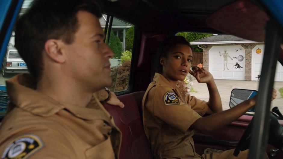 Amaya talks Nate in the truck while disguised as Animal Control agents.
