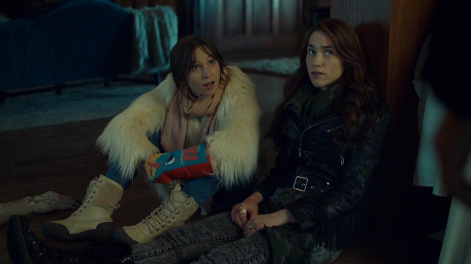 Waverly and Wynonna look up at Kevin as she tells them that Waverly is the chosen one.
