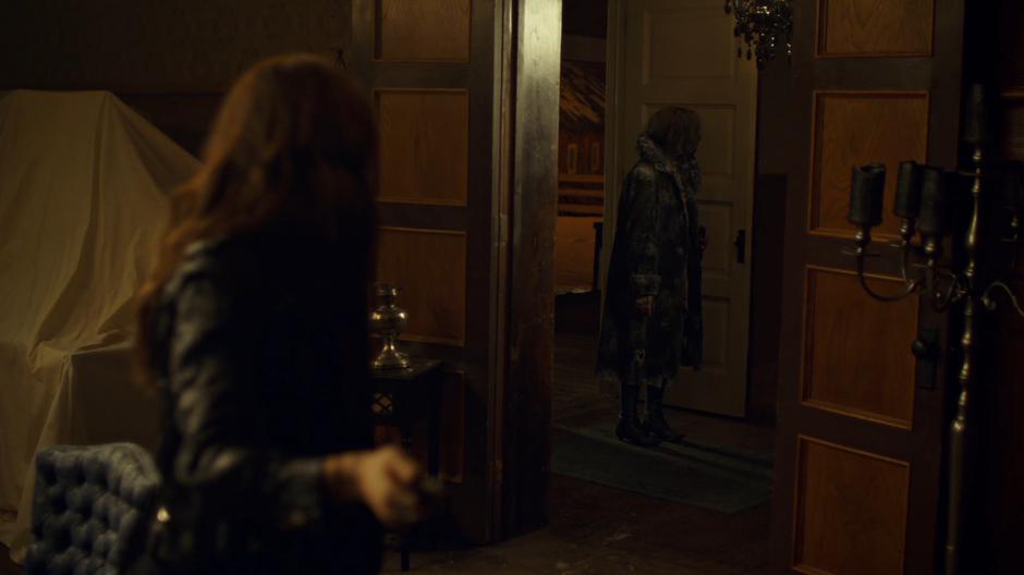 Wynonna turns as the burnt Constance Clootie enters the mansion.