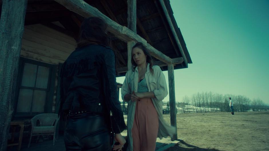 Waverly tells Wynonna about Charlie while standing in front of the house.