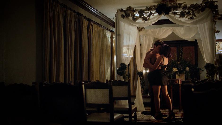 Chase and Gert kiss while taking off their clothes in the empty chapel.