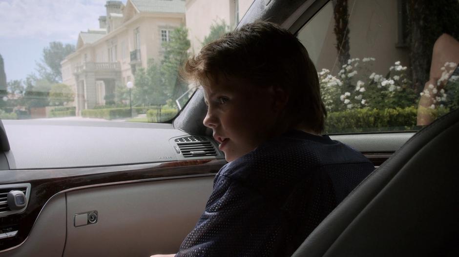 Young Chase talks to his father from the passenger seat of the car.