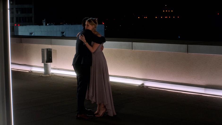 Chase and Karolina hug after she flies herself back to safety.