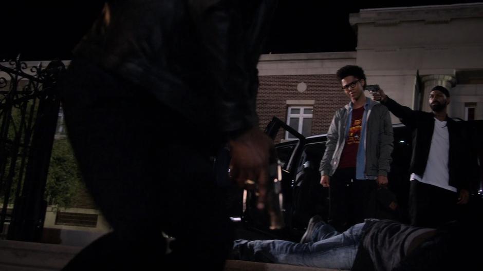 Darius Davis holds a gun to Alex's head and tells Geoffrey to stop fighting.
