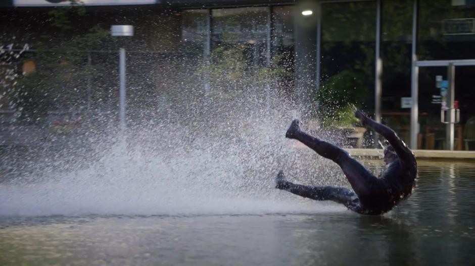 Barry slides along the surface of the shallow pond.