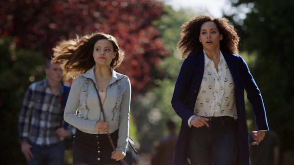 Maggie and Macy run down the pathway to help Mel.