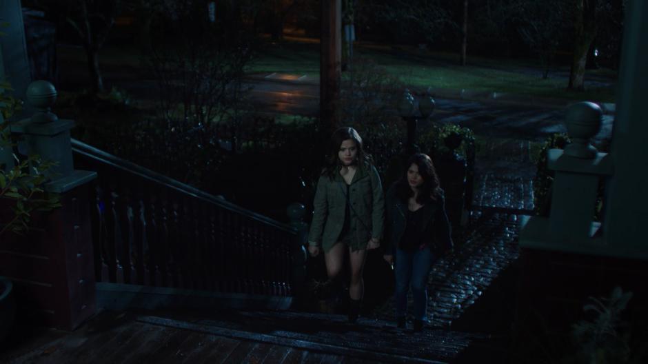 Maggie and Mel walk up the steps of the house after being called back home by their mother.