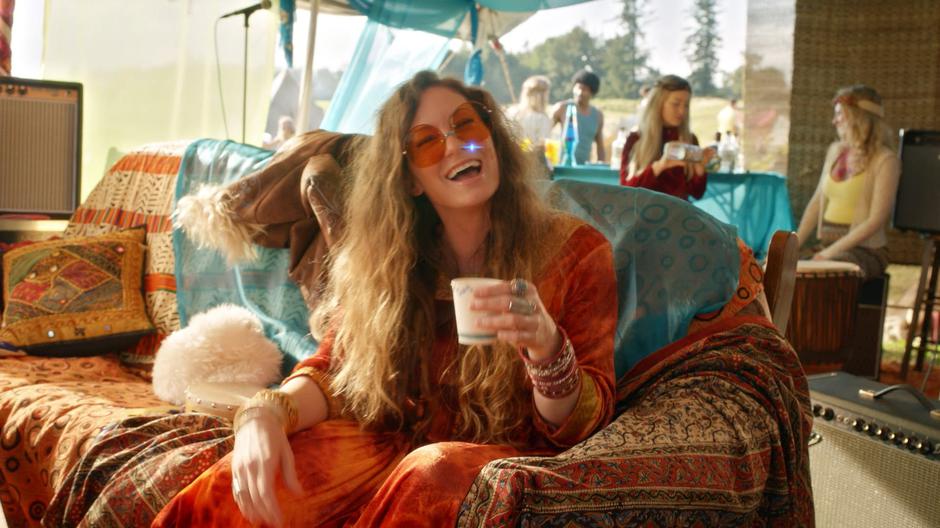 Janis Joplin smiles at tiny-Ray as he steals one of her hairs for the spell.