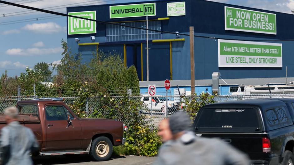 The workers run across the street to the Universal NTH factory.