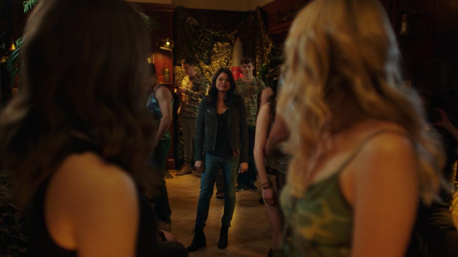 Maggie and Lucy turn to face Mel in the entrance.