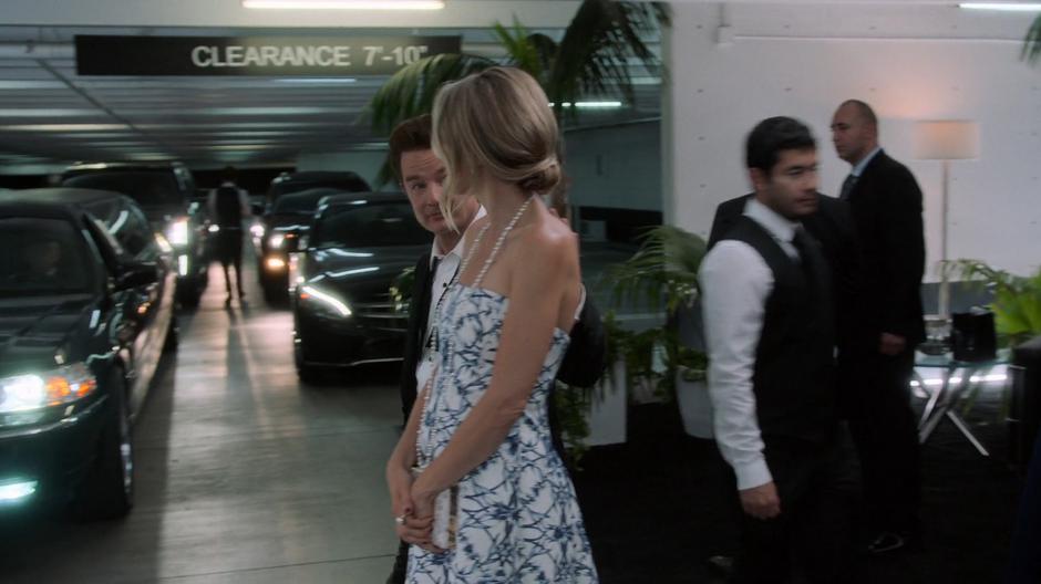 Victor and Janet walk back to their car in the parking garage after the party.