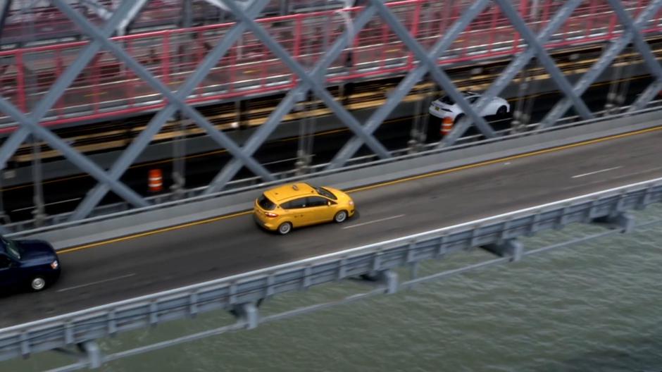 Bull's taxi drives across the outer roadway on the bridge.