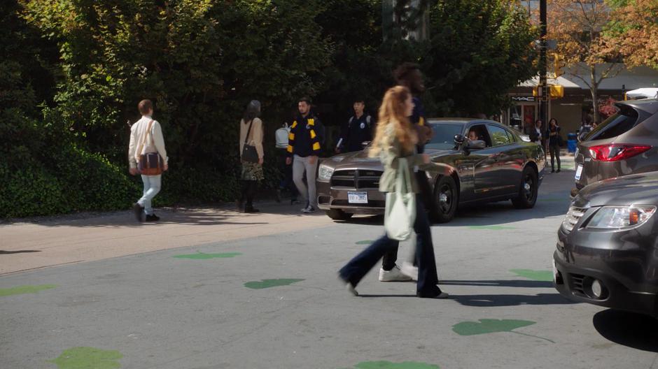 Trip watches the sisters from his unmarked car.