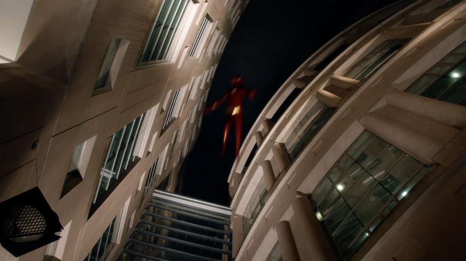 Barry flies off into the air after being hit by Null's power.