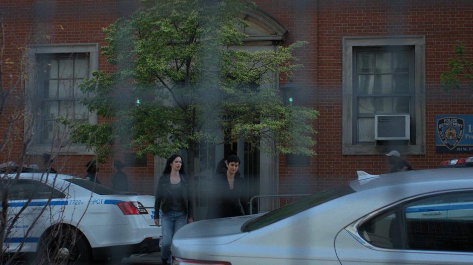 Hogarth escorts Jessica out of the police station to her car.