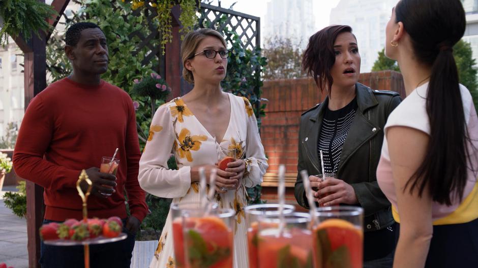 J'onn, Kara, and Alex react when Lena tells them that Brainy got drunk.