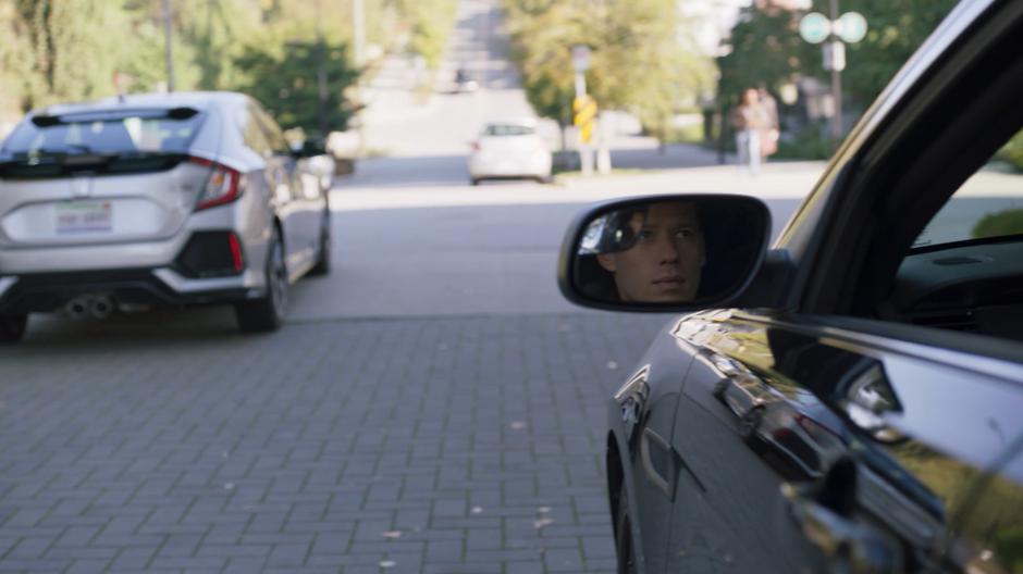 Hunter watches from his car as Niko drives away from the restaurant.