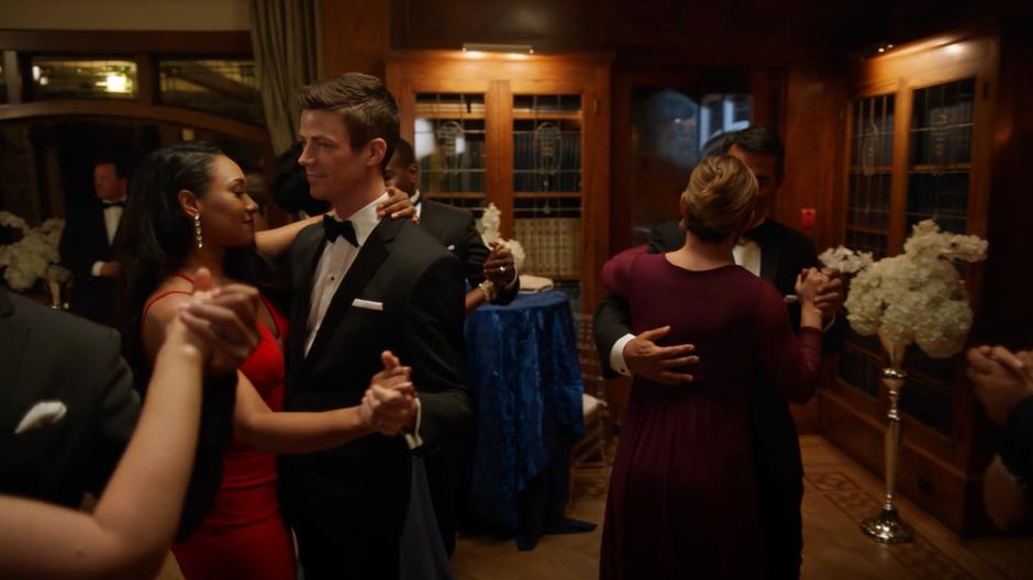 Iris and Barry spin around on the dance floor.