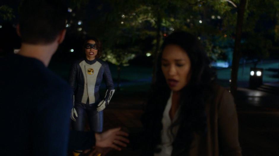 Nora zips up just as Barry and Iris land safely on the ground.