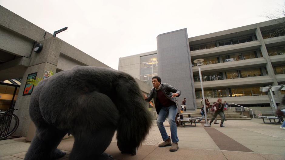 Young Barack Obama stops in his tracks as Grodd lands in front of him.