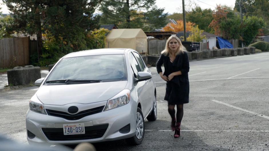 Liv exits her car and walks over to the other members of the underground.