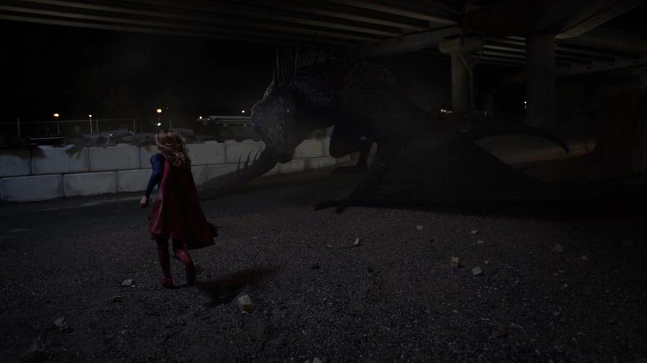 Kara runs over while calling out Spike's name after he lands near her.